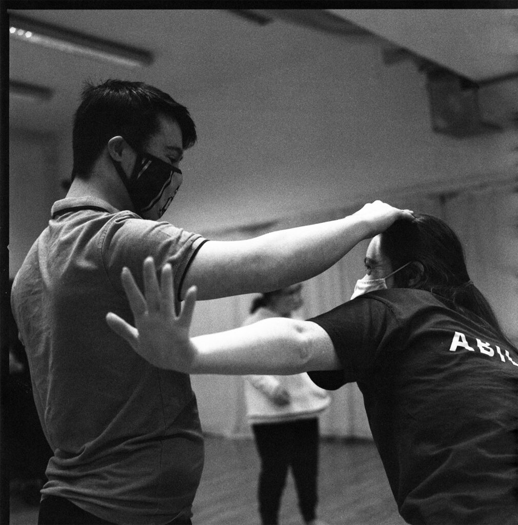 A black and white photo of two dancers caught in motion