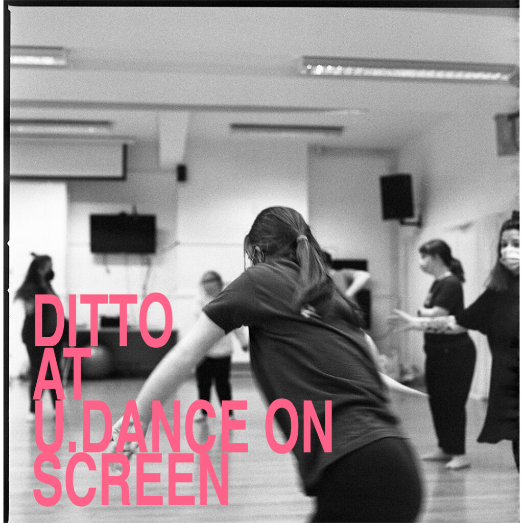 Dancers caught in motion, rehearsing in their studio. Closest to us, in the centre of the image, a dancer with their back to us is caught in a twisting movement. To the right is another dancer with arm splayed outwards. There are three other dancers, slightly out of focus in the distance. Overlaying the black and white image, in the bottom left hand corner, pink text reads DITTO AT U.DANCE ON SCREEN
